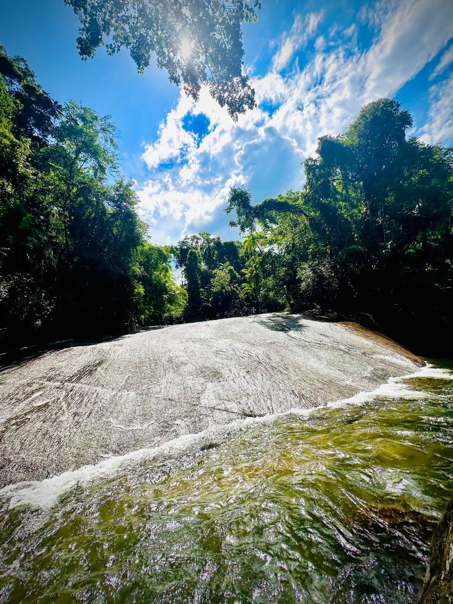 Sliding down Tobogã Waterfall is one of Paraty's most unforgettable experiences.